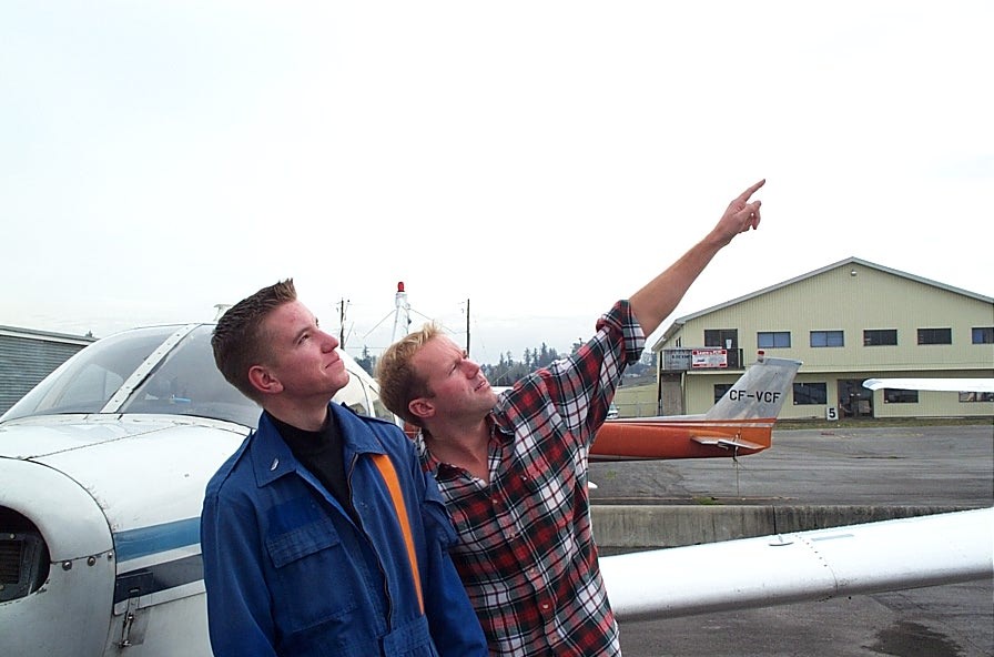 Philip Craig, as a Commercial Pilot Student, with his Flight Instructor, David Woollam.  Philip is now Langley Flying School's Senior IFR Instructor and David Woollam is a Twin Otter Captain.  Langley Flying School.